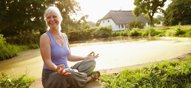 Woman with big smile doing Yoga